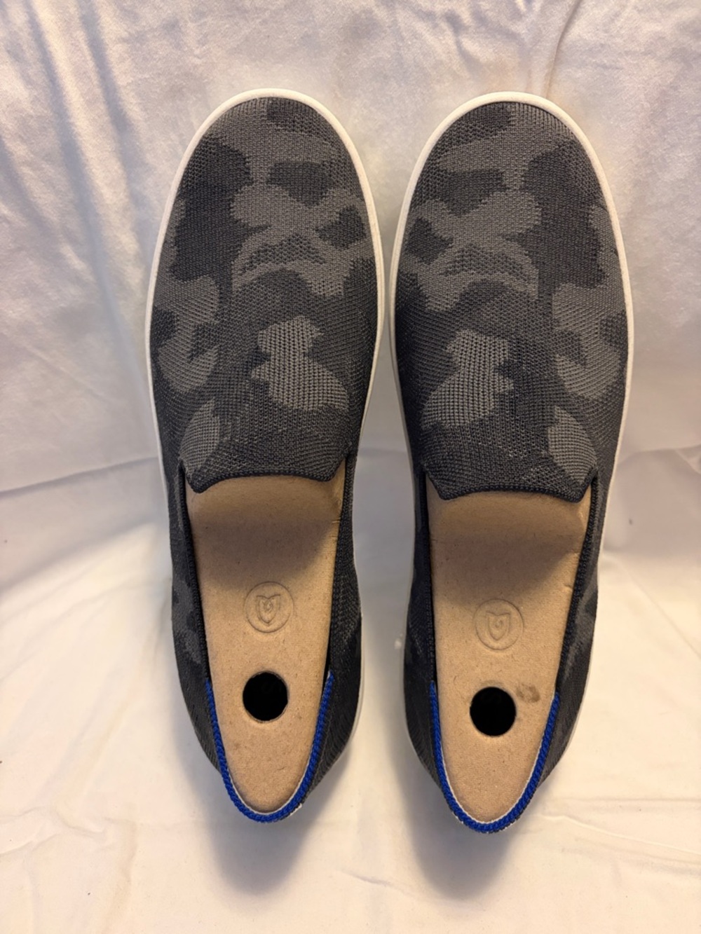 Rothy’s Grey Camo slip on shoes.
